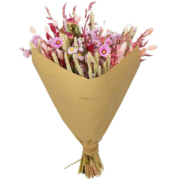 Bouquet of flowers wrapped in brown paper on a white background
