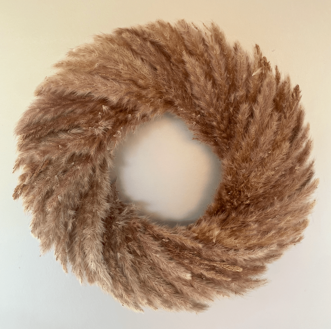 Brown faux fur wreath on a light background