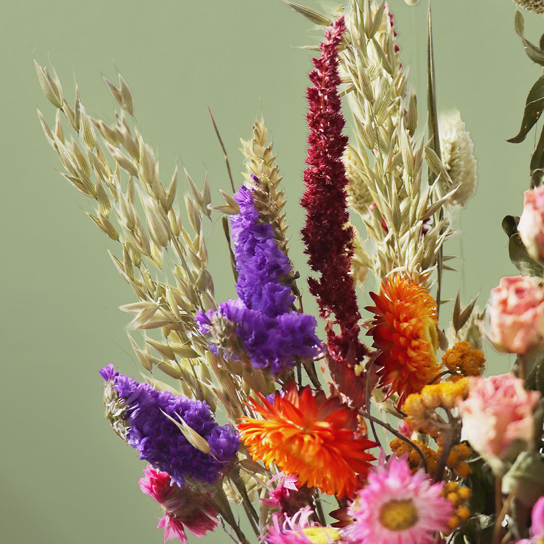 Colorful bouquet of flowers with a green background