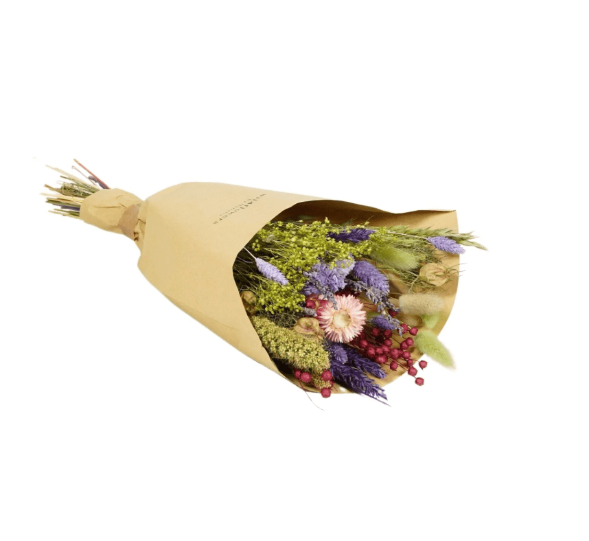 Bouquet of flowers wrapped in brown paper on a white background