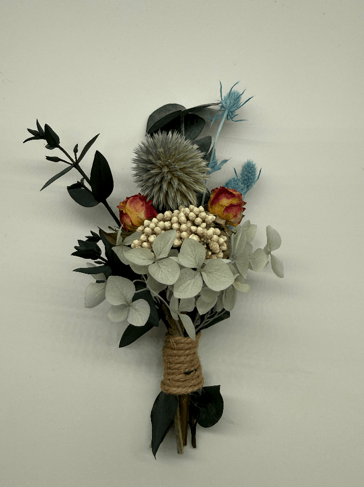 Bouquet of flowers with greenery and berries on a white background