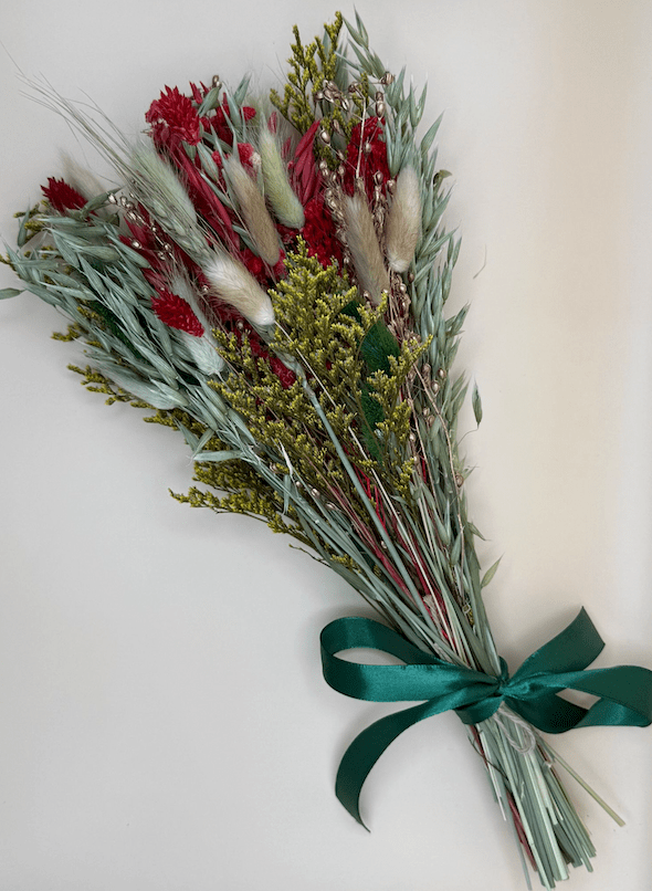 Bouquet of flowers with a green ribbon on a white background