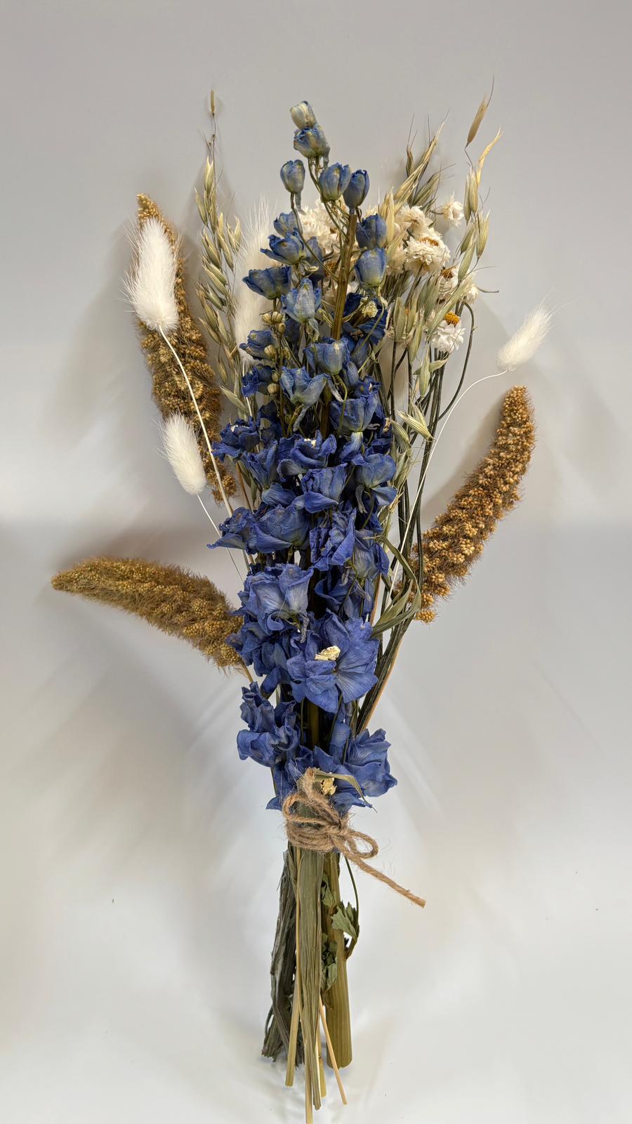 letter-size small bouquet of blue, brown and white blooms