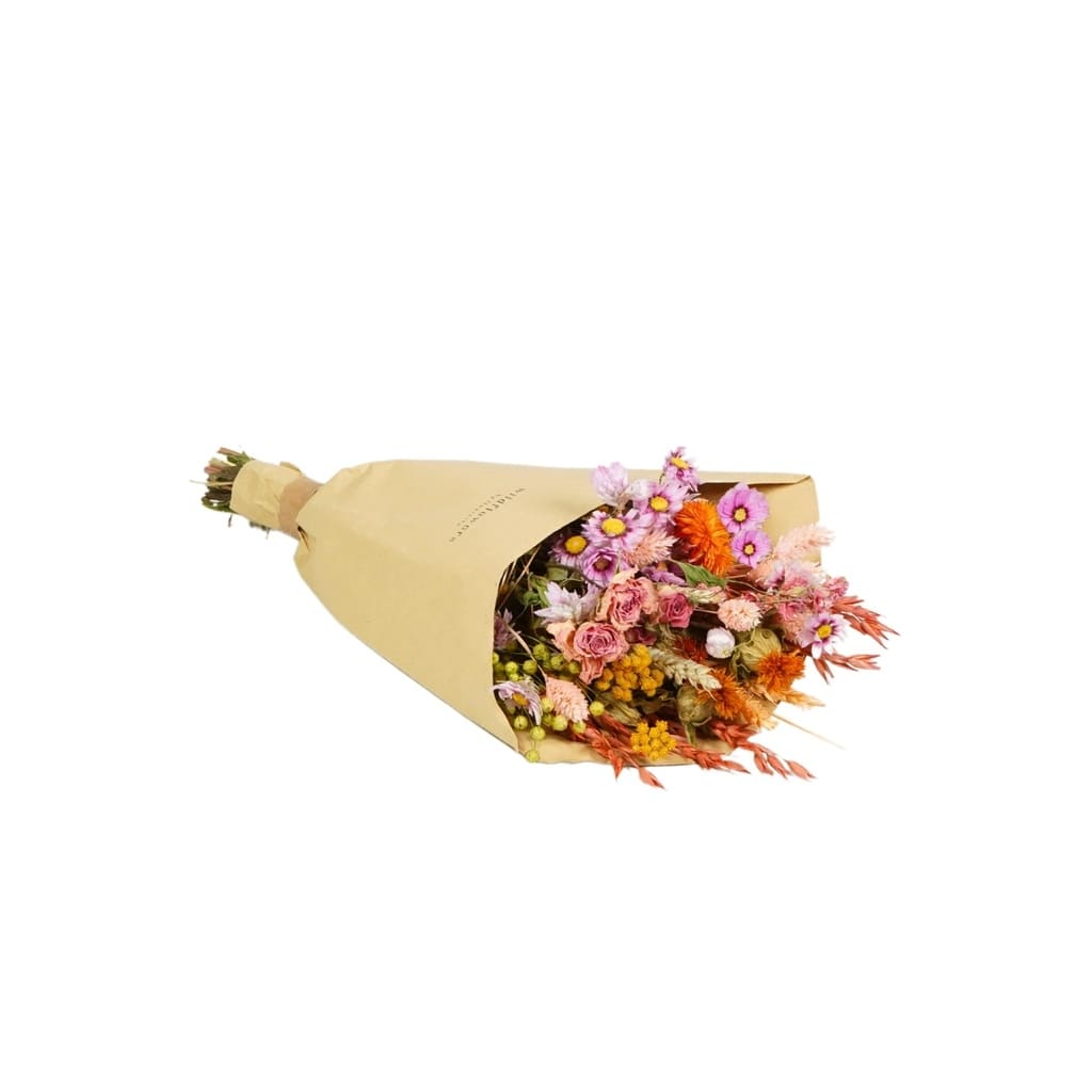 Bouquet of flowers in a beige paper cone on a white background