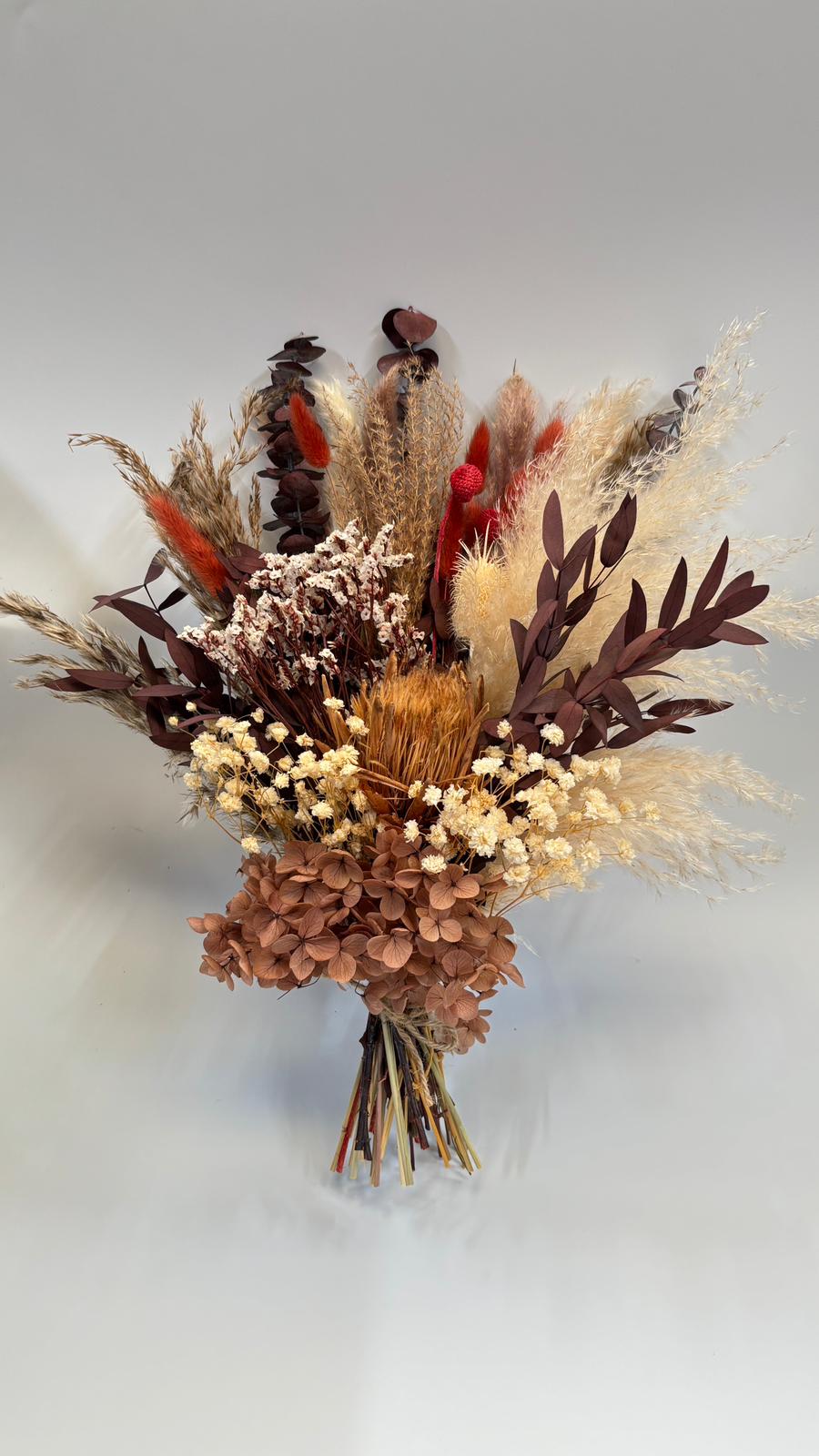 large boukuet in dark tones: beige, purple, red, brown