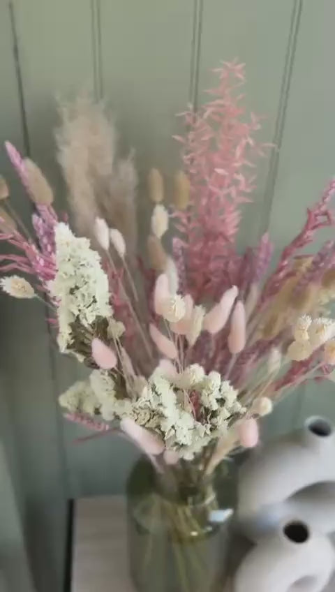 Zoom in video of pink and white dried flower bouquet